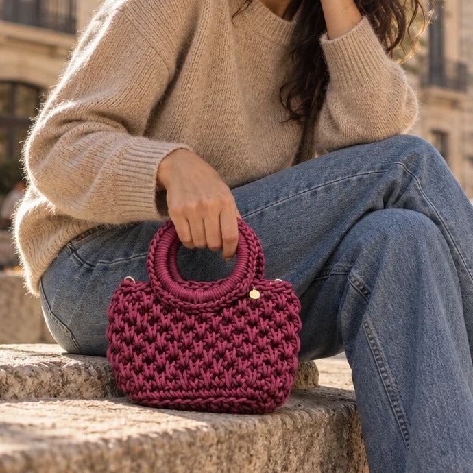 Bolso de Mano Agadir Mini | Create an ultra-photorealistic commercial photograph featuring the uploaded Bolso de Mano Agadir Mini in the provided image as the hero product.