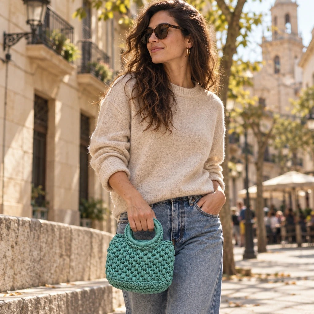Bolso de Mano Agadir Mini | Create an ultra-photorealistic commercial photograph featuring the uploaded Bolso de Mano Agadir Mini in the provided image as the hero product.