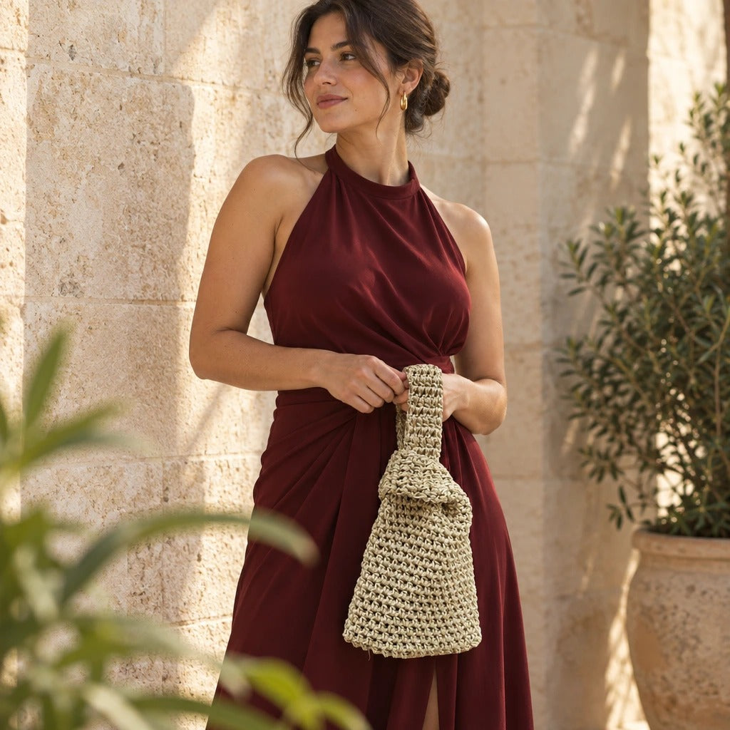 Bolso de Mano Merzouga | Create an ultra-photorealistic lifestyle photograph centering the uploaded Bolso de Mano Agadir Mini Metalizado in the provided image as the only source of trut